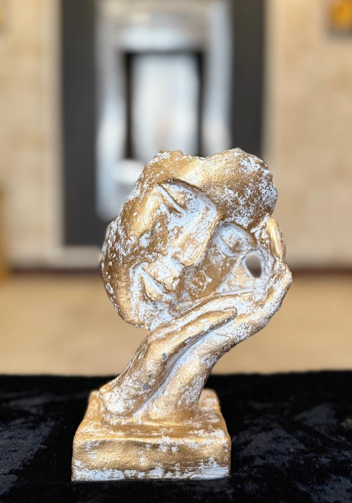 Hand Holding Heart Sculpture